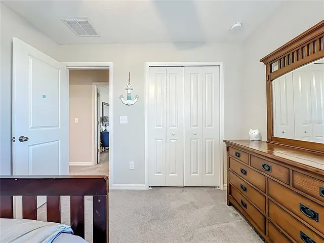 an aerial view of a house with a yard swimming pool and outdoor seating