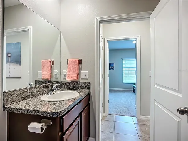 an aerial view of a house with a swimming pool