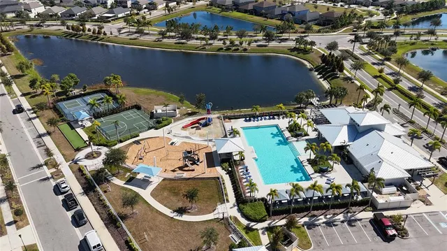 an aerial view of residential houses with outdoor space