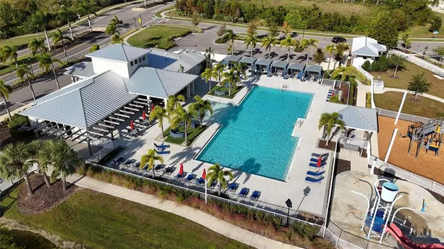 an aerial view of house with yard