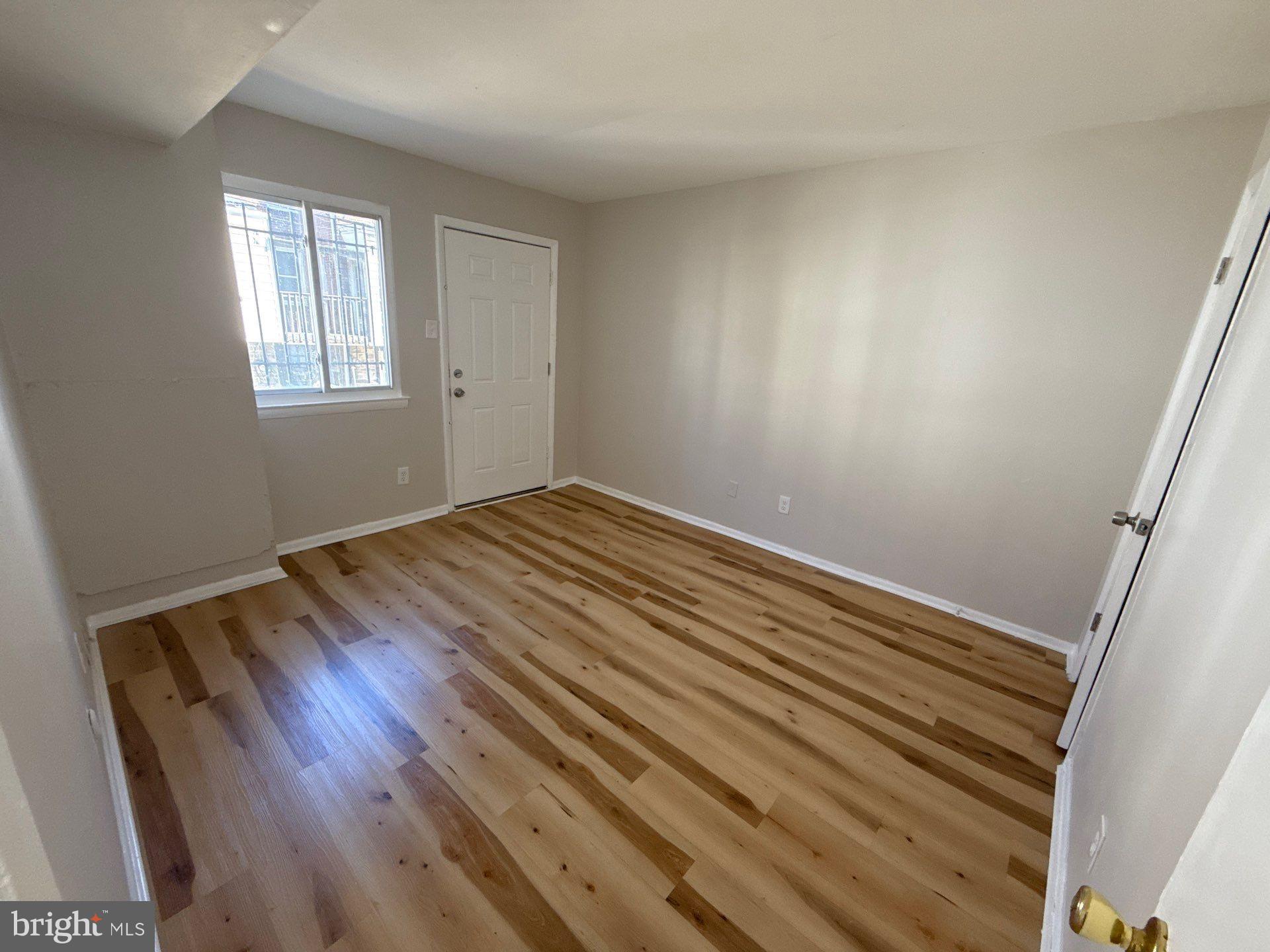 573 Allengrove Street Philadelphia, PA 19120 - Photo 15 of 16 Bedroom 2 with back door access.