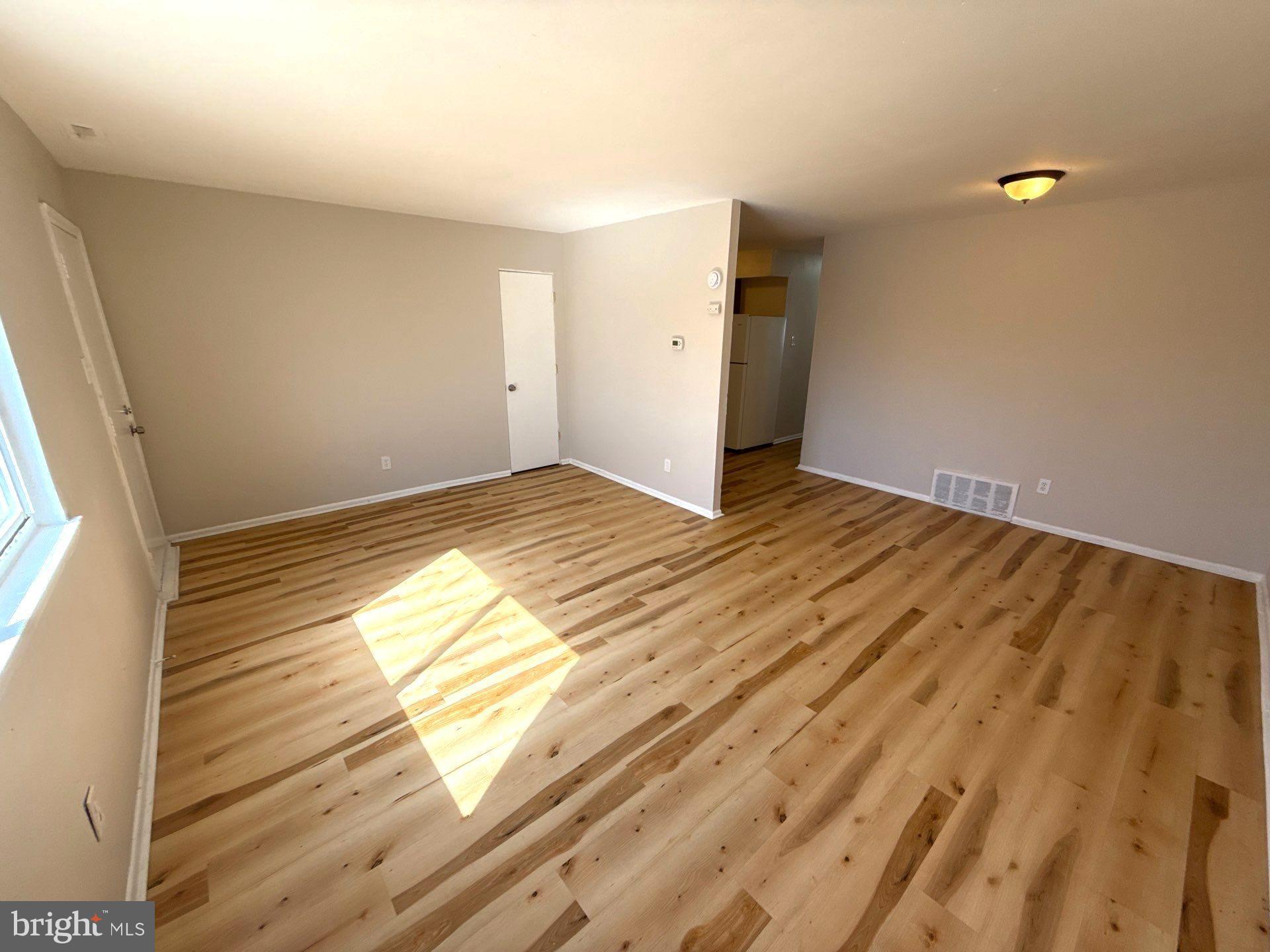 573 Allengrove Street Philadelphia, PA 19120 - Photo 5 of 16 Living room and dining area