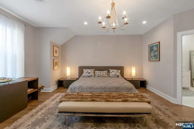 a spacious bedroom with a bed and window