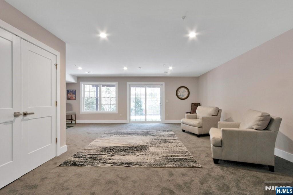 704 Opus Way, Unit 704 Montvale, NJ 07645 - Photo 25 of 33 a living room with furniture and a window