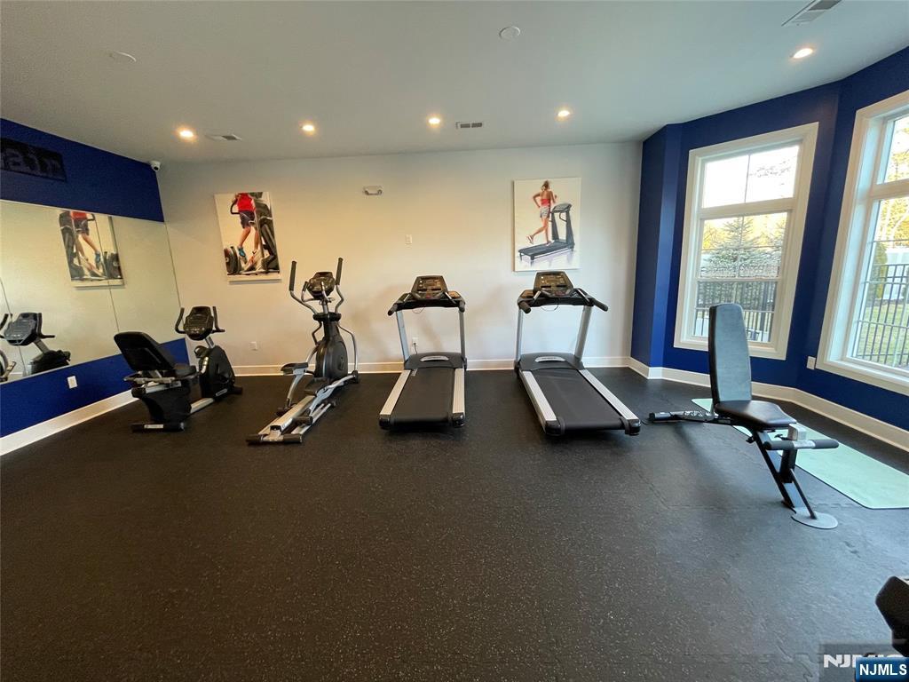 704 Opus Way, Unit 704 Montvale, NJ 07645 - Photo 28 of 33 a view of a room with gym equipment