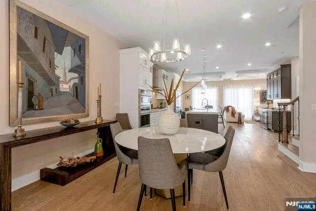 a large kitchen with a table and chairs