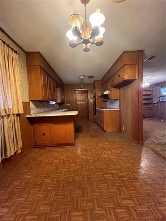 a kitchen with stainless steel appliances a stove and a refrigerator