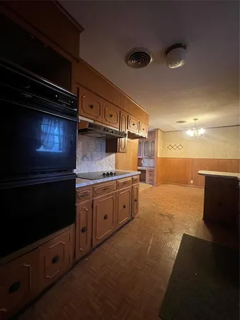 a kitchen with a sink and cabinets
