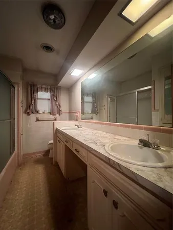 a bathroom with a sink and mirror