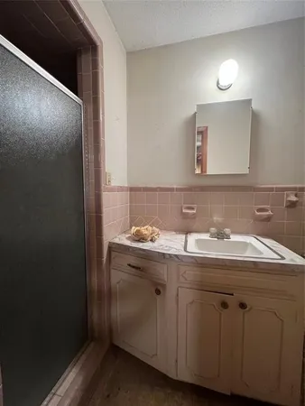 a view of an empty room and a window