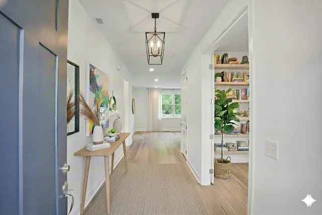 view of hall way with furniture