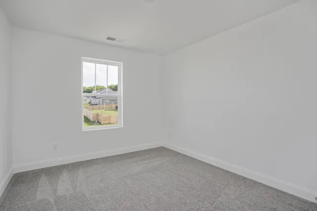a bathroom with a double vanity sink mirror and shower