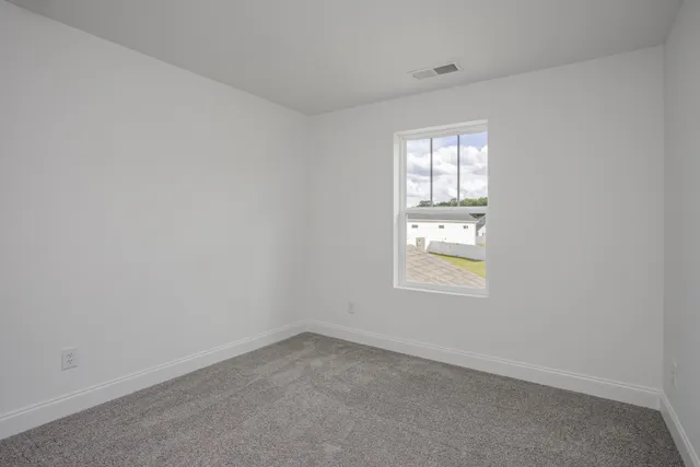 a white bath tub sitting next to a shower