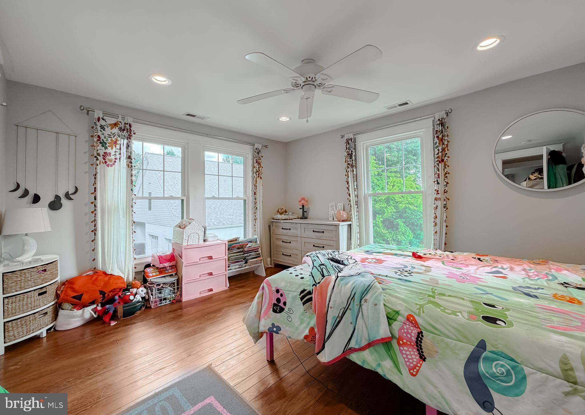 16146 Thomas Road Piney Point, MD 20674 - Photo 27 of 57 a bed room with a bed a table and a window