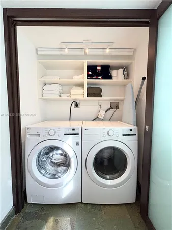 a utility room with dryer and washer