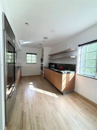 a view of an empty room and glass door