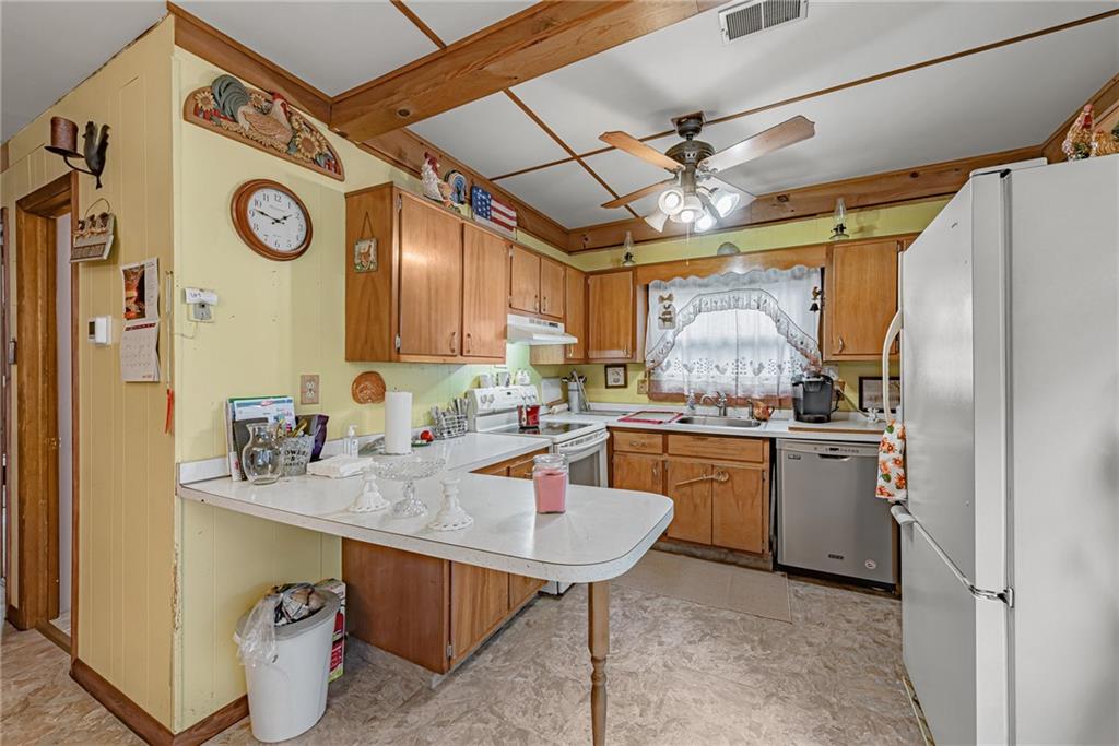 142 Westlake Road Acme, PA 15610 - Photo 13 of 25 a kitchen with a sink appliances and cabinets
