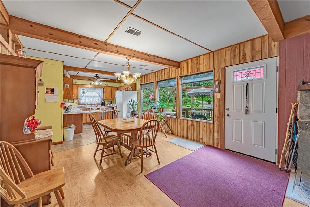 142 Westlake Road Acme, PA 15610 - Photo 15 of 25 a dining room with furniture and a floor to ceiling window