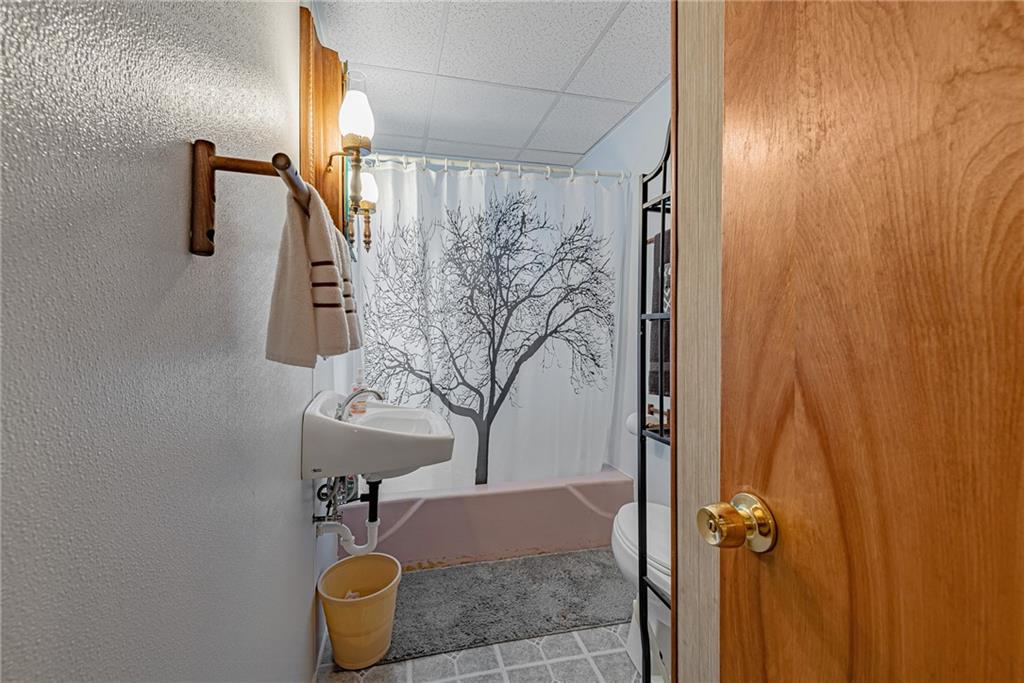 142 Westlake Road Acme, PA 15610 - Photo 16 of 25 a bathroom with a sink and mirror