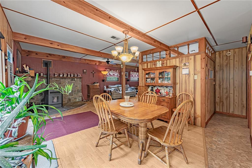 142 Westlake Road Acme, PA 15610 - Photo 2 of 25 a dining room with furniture and a potted plant