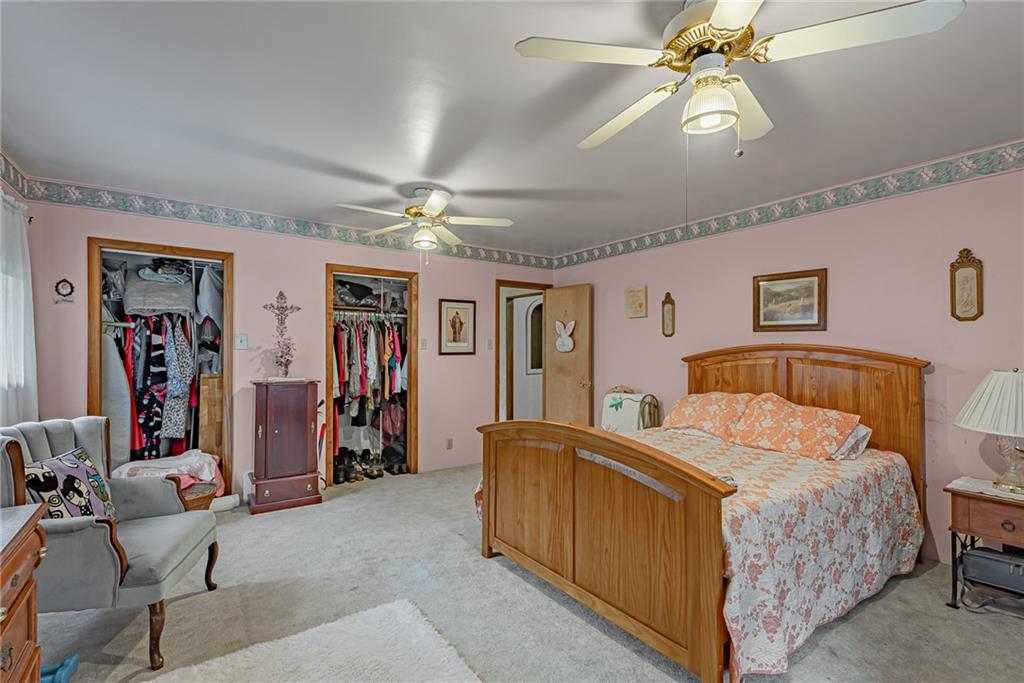 142 Westlake Road Acme, PA 15610 - Photo 22 of 25 a bedroom with a bed and ceiling fan