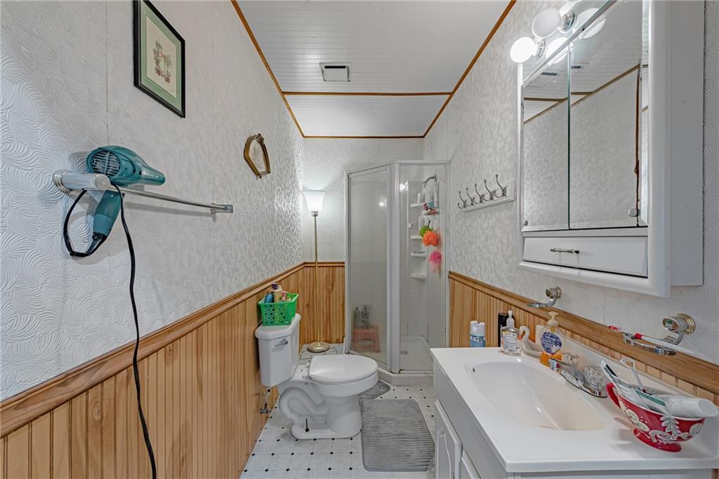 142 Westlake Road Acme, PA 15610 - Photo 24 of 25 a bathroom with a sink a toilet and shower