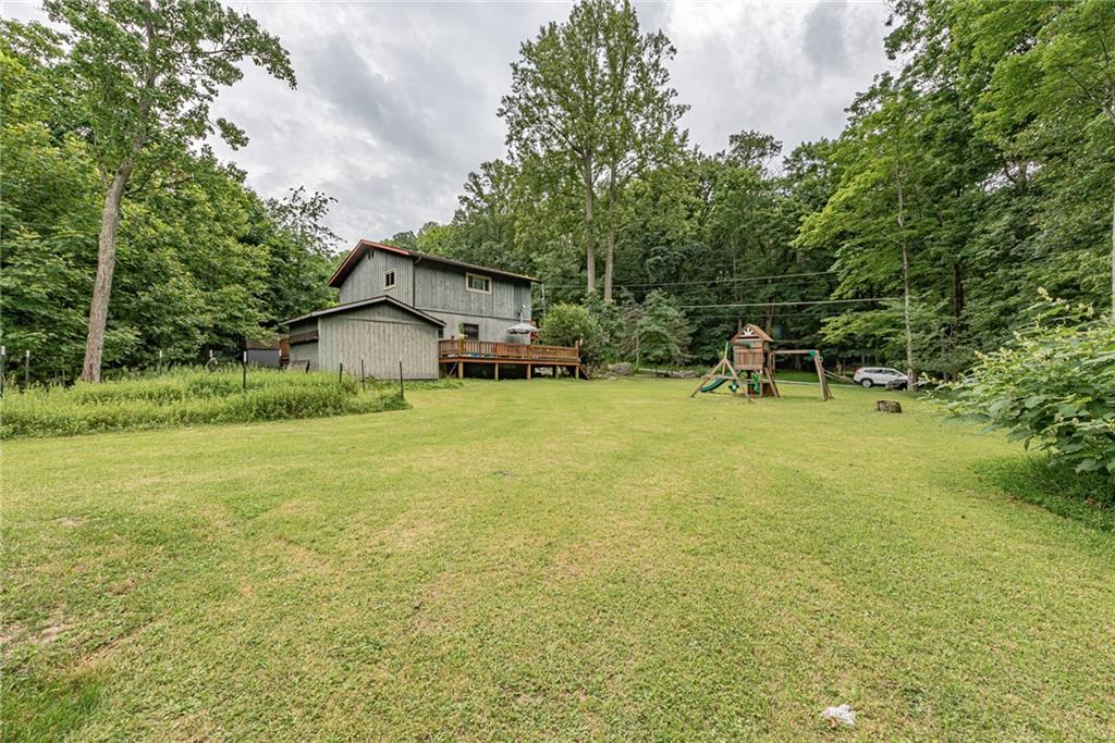 142 Westlake Road Acme, PA 15610 - Photo 5 of 25 a view of a house with patio and garden