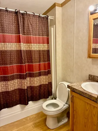 a bathroom with a granite countertop shower