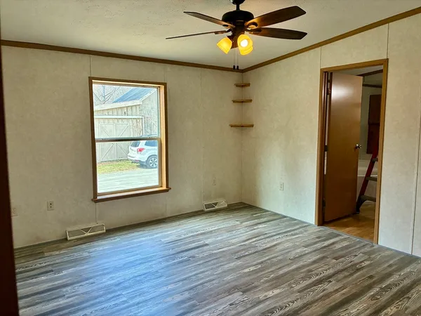 a white bath tub sitting next to a window