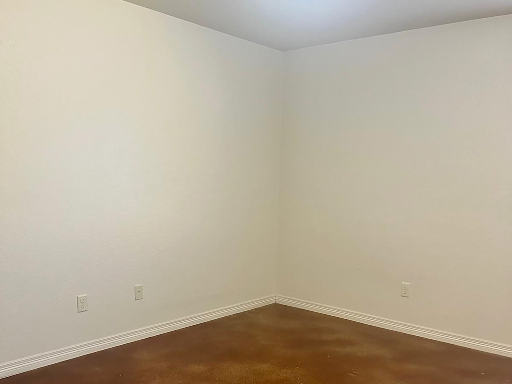 504 Karey Drive Temple, TX 76502 - Photo 11 of 18 Empty room with finished concrete floors and baseboards