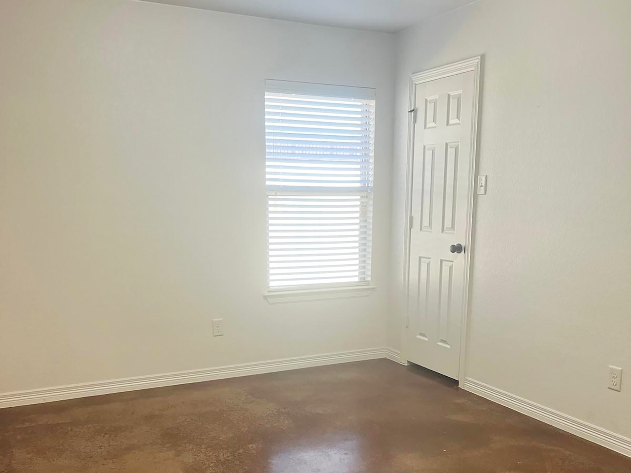504 Karey Drive Temple, TX 76502 - Photo 12 of 18 Unfurnished room with finished concrete flooring and baseboards