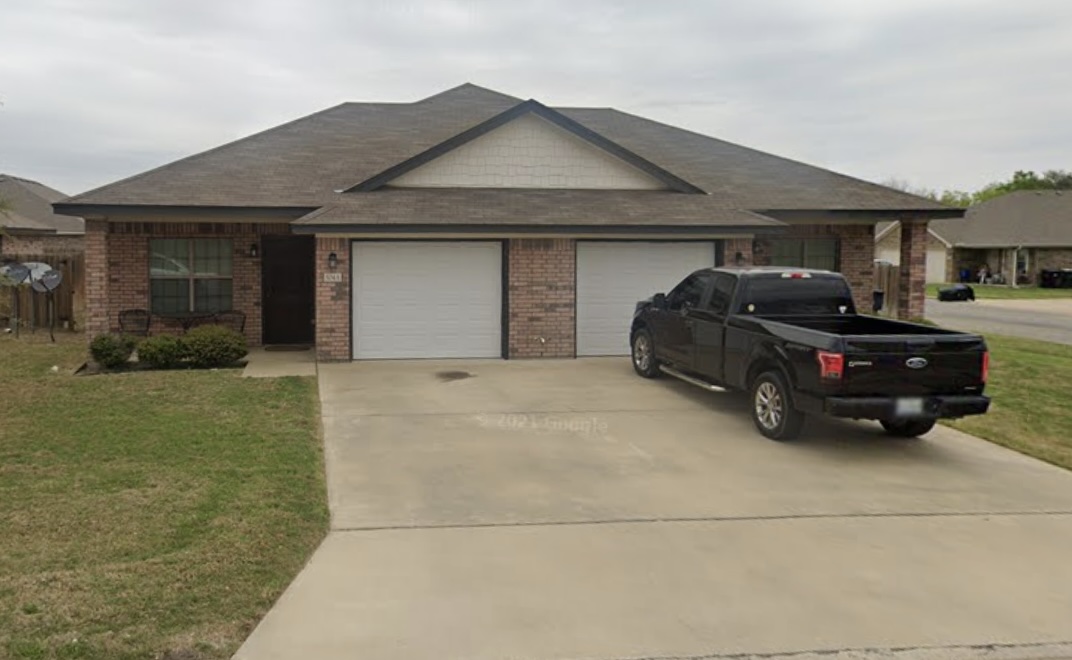 504 Karey Drive Temple, TX 76502 - Photo 18 of 18 Ranch-style home with a front yard, driveway, brick siding, and a garage