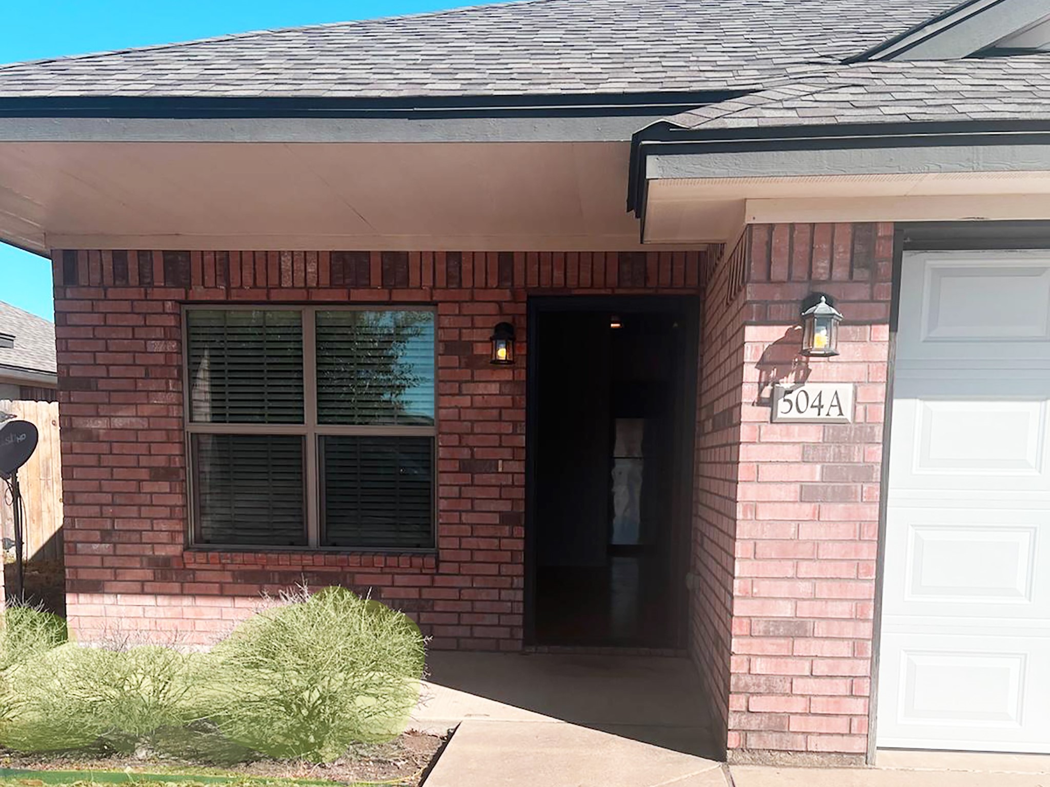 504 Karey Drive Temple, TX 76502 - Photo 2 of 18 Entrance to property featuring brick siding and a shingled roof