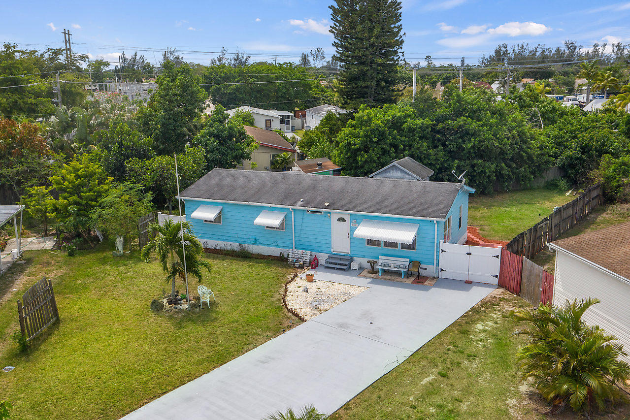 11941 Flotilla Place Boca Raton, FL 33428 - Photo 1 of 21 an aerial view of a house with swimming pool and a yard
