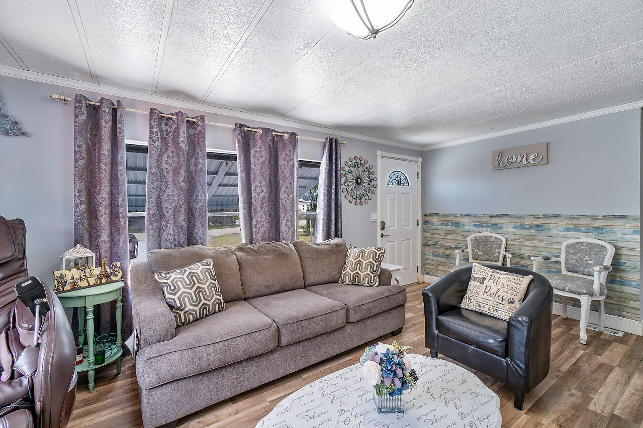 11941 Flotilla Place Boca Raton, FL 33428 - Photo 11 of 21 a living room with furniture and a large window