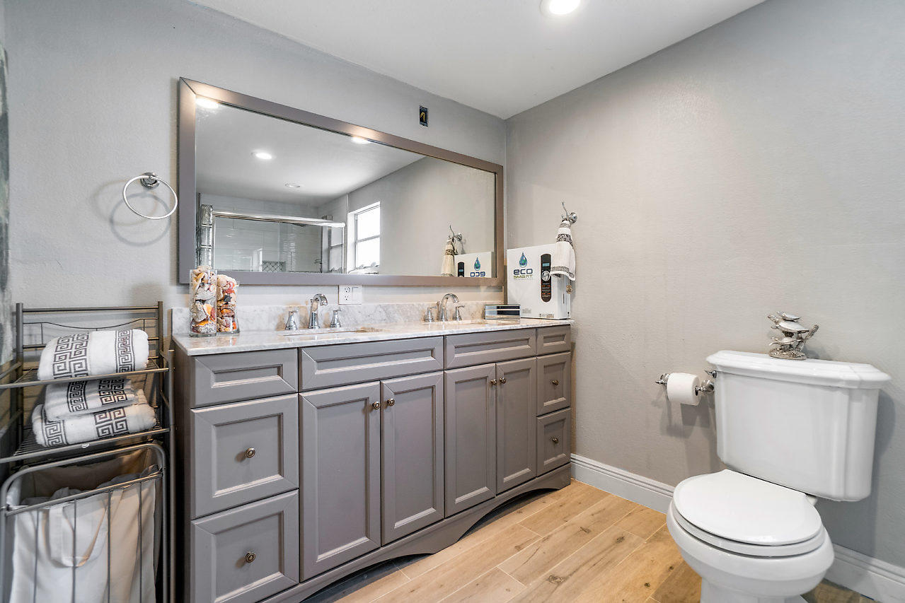11941 Flotilla Place Boca Raton, FL 33428 - Photo 12 of 21 a bathroom with a granite countertop toilet sink and mirror
