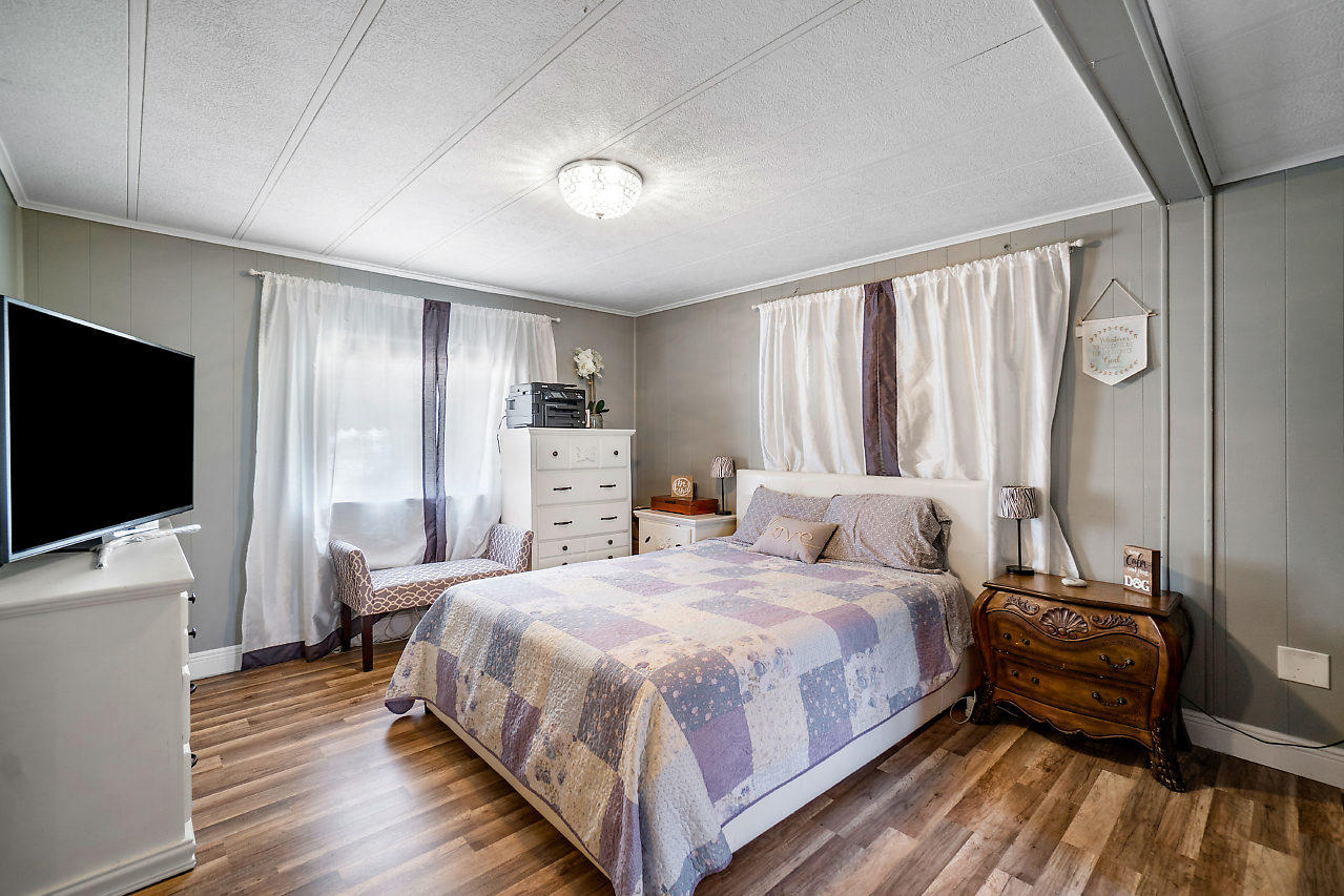 11941 Flotilla Place Boca Raton, FL 33428 - Photo 14 of 21 a bedroom with a bed and a flat screen tv