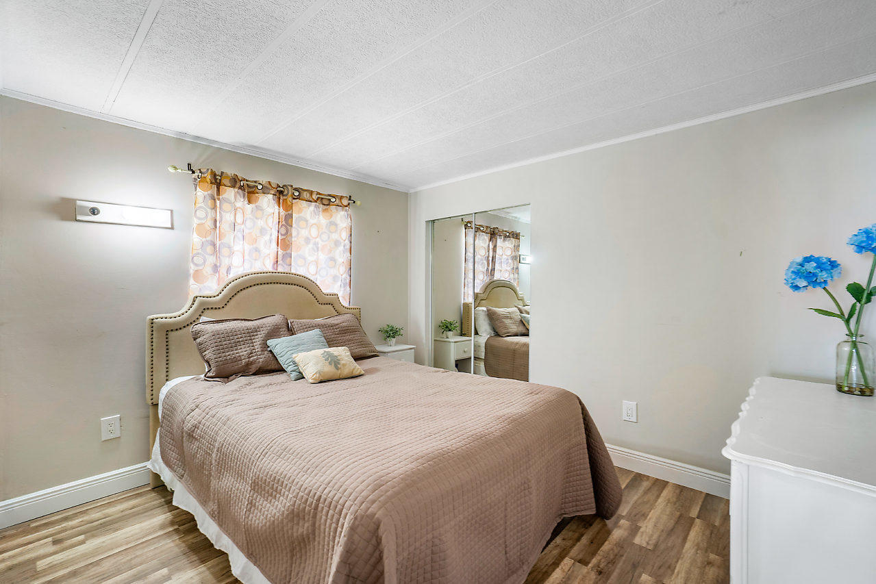 11941 Flotilla Place Boca Raton, FL 33428 - Photo 18 of 21 a bedroom with a bed and a window