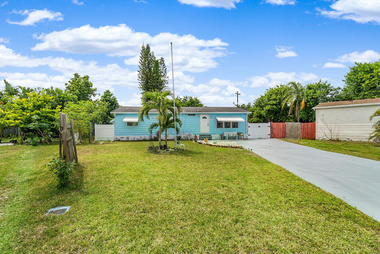 11941 Flotilla Place Boca Raton, FL 33428 - Photo 3 of 21 a swimming pool with outdoor seating and yard