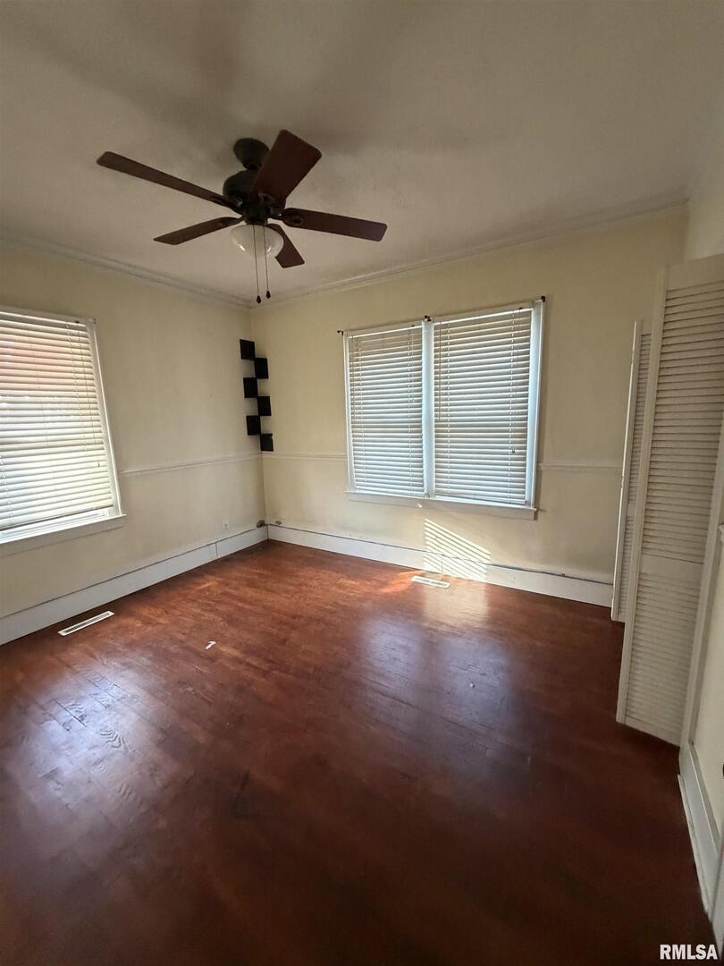 510 North Maple Street Benton, IL 62812 - Photo 14 of 21 a view of empty room with wooden floor and fan