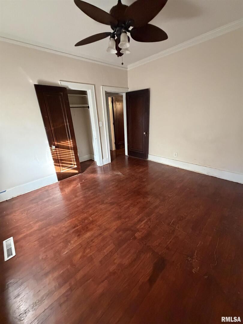 510 North Maple Street Benton, IL 62812 - Photo 9 of 21 an empty room with windows and ceiling fan
