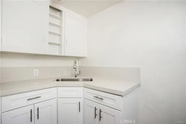 a view of cabinets with tap