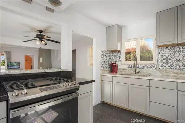 a kitchen with a stove and a sink