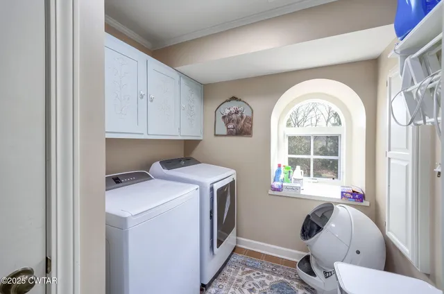 a bathroom with a double vanity sink mirror and shower