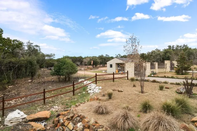 a view of a house with backyard porch and sitting area