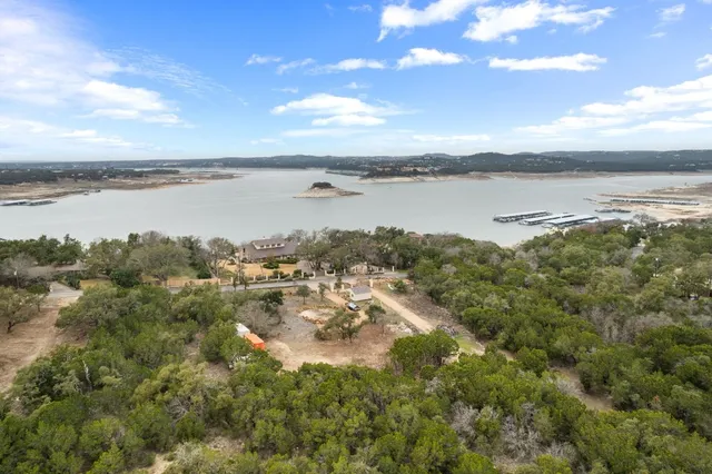 a view of a lake with houses in the back