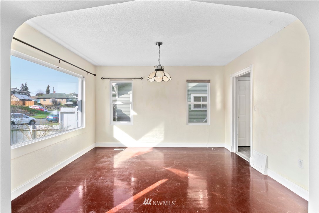 3709 Rockefeller Avenue Everett, WA 98201 - Photo 4 of 12 a view of livingroom with hardwood floor and a window