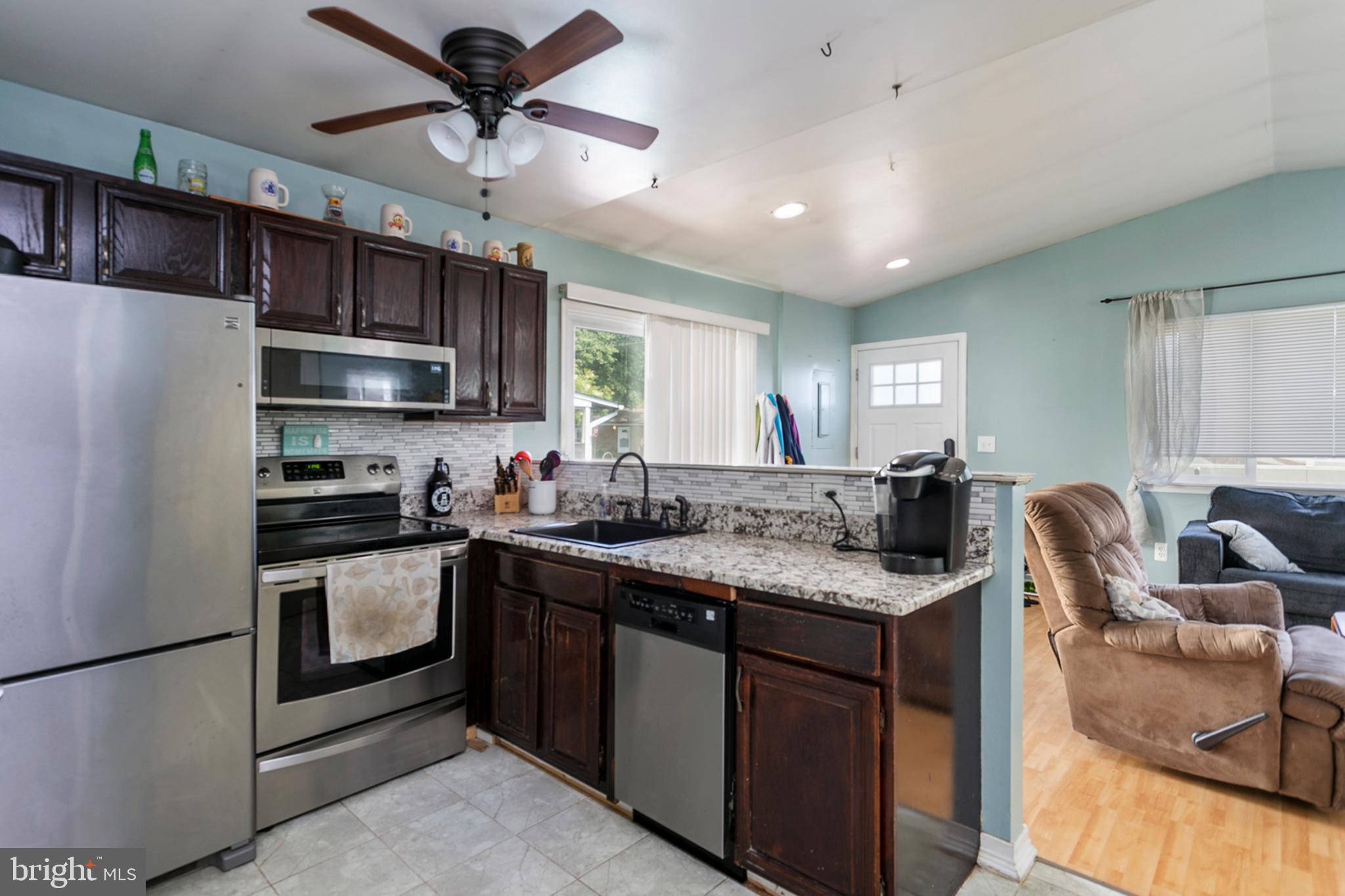 1638 Bay Ridge Road Edgewater, MD 21037 - Photo 7 of 21 Renovated kitchen with stainless steel appliances!