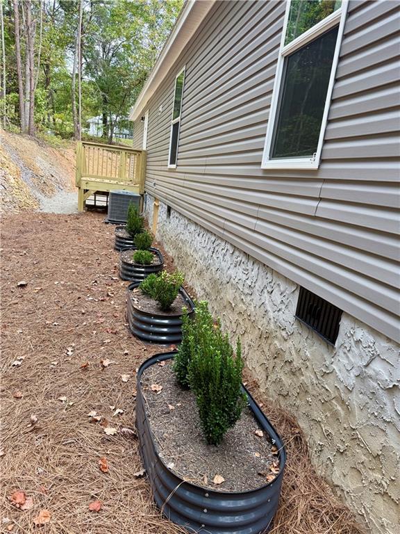 57 Highland Tree Court Ranger, GA 30734 - Photo 15 of 39 a view of a backyard with chairs and potted plants