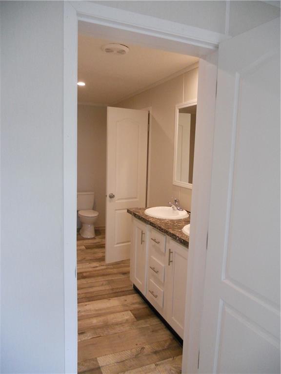 57 Highland Tree Court Ranger, GA 30734 - Photo 27 of 39 a bathroom with a granite countertop sink and a mirror